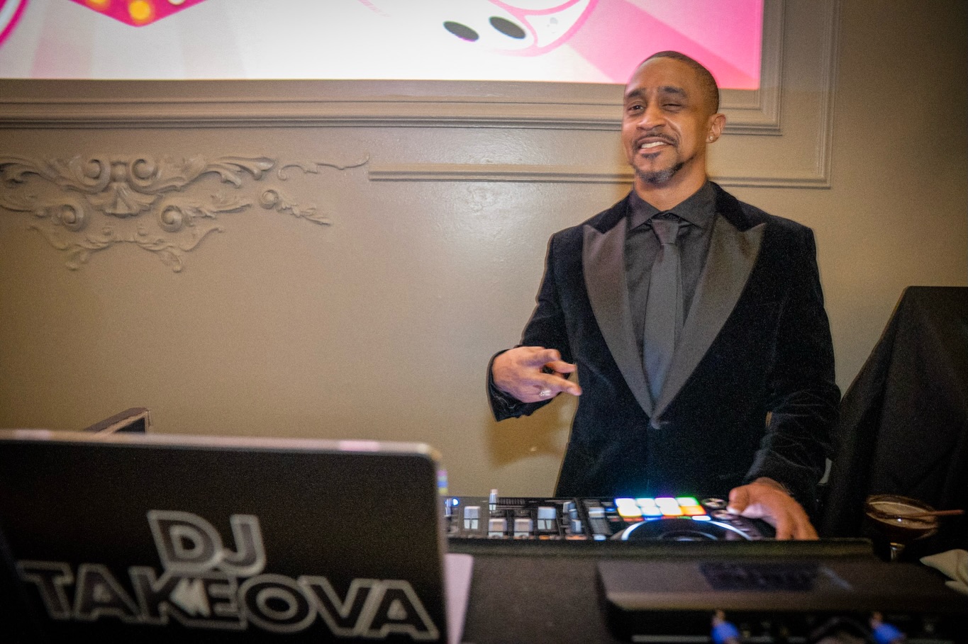 DJ Takeova in formalwear at a corporate event