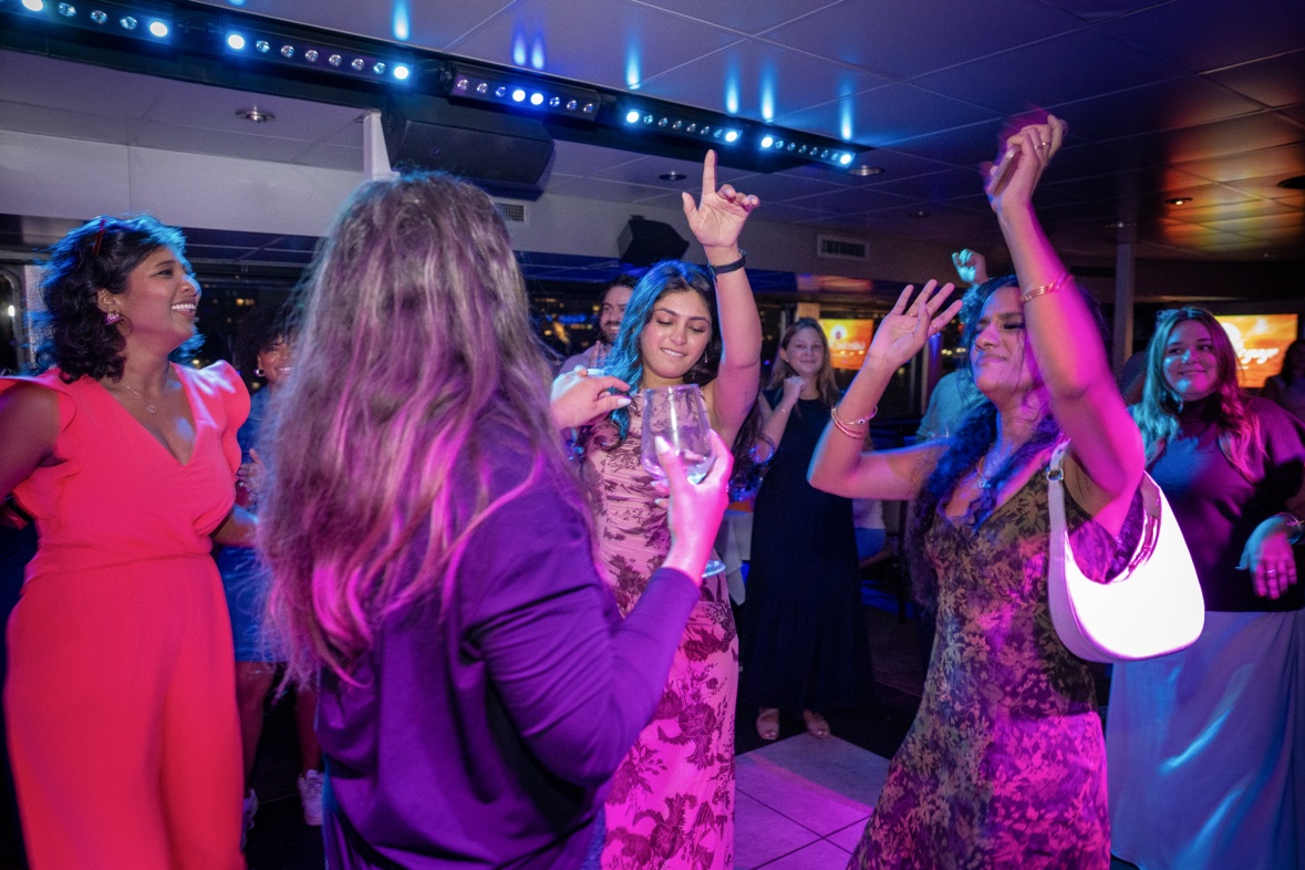 Guests dancing with their hands in the air at a party